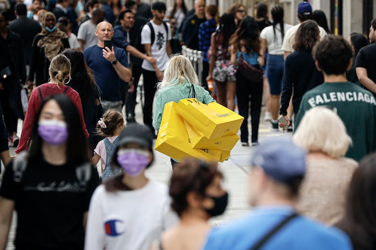 People walk in London on Monday.
