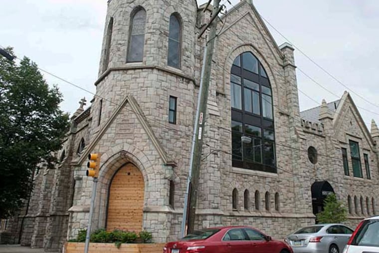 The outside of the North Abbey apartments on Girard Ave.. This church built in 1888 has been converted into an apartment complex. (MICHAEL PRONZATO / Staff Photographer)
