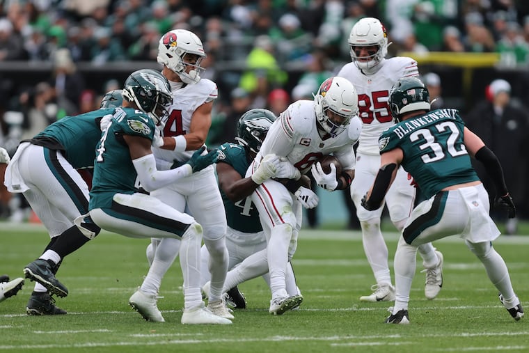 Eagles linebacker Nicholas Morrow brings down Arizona Cardinals running back James Conner, who had a huge game.