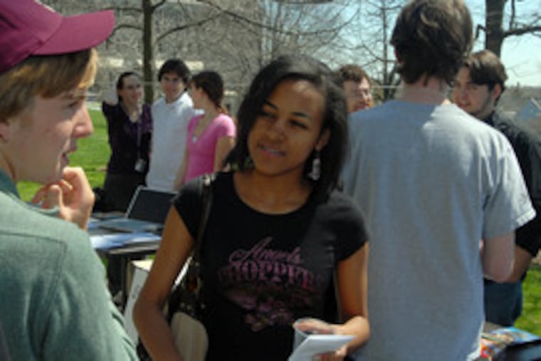 Swarthmore College students try to sell Becky Emiru, 18, of Chicago, on the merits of their school. She listened with interest, but she's also being pitched by Rice and Amherst.
