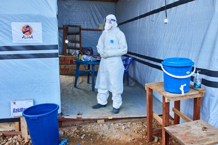 A health worker stands at the Evangelical Medical Center, in Bunia, eastern Congo, Friday, July 3, 2026, where Ebola clinical trials are scheduled to take place.