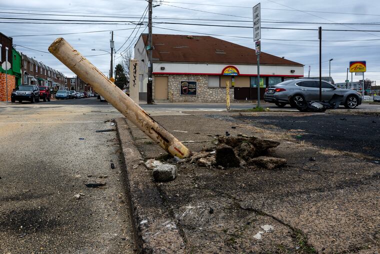 The scene at Torresdale and Harbison Avenues in Frankford Sunday, where an infant was killed and her mother seriously injured after a private ambulance sped through a red light and crashed.