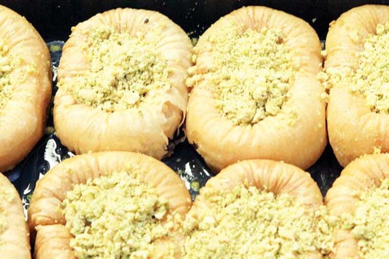 Finished product of cooking class by chef Fouad Aoudia teaching, students and at the Manakeesh Cafe 4420 Walnut St., Friday, June 7, 2013. Finished Bracelets Baklava. ( Steven M. Falk / Staff Photographer )