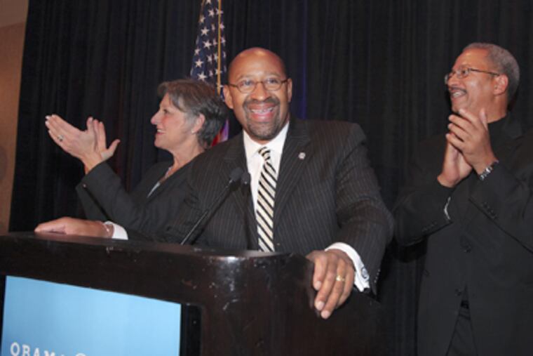Mayor Nutter, with Reps. Allyson Schwartz and Chaka Fattah (right), speaks to Obama supporters at the Raddison Plaza-Warwick Hotel on Election Night. (Steven M. Falk / Staff Photographer)