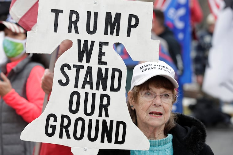 A supporter of President Donald Trump attends a rally at Freedom Plaza, Saturday, Dec. 12, 2020, in Washington.