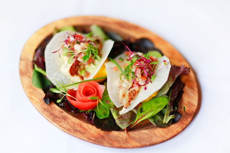 Barramundi tacos wrapped in sheer sheets of jicama at Tequila's.