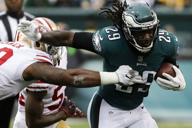 Eagles running back LeGarrette Blount runs past San Francisco 49ers defensive tackle DeForest Buckner during the first-quarter on Sunday.