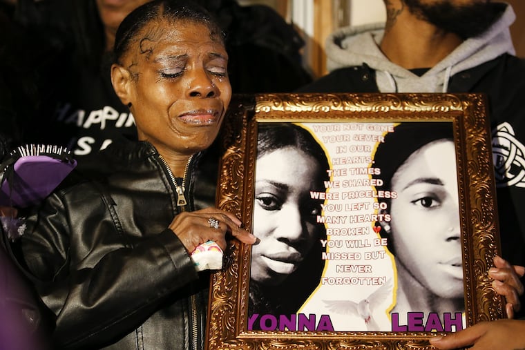 Sharon Hopkins, grandmother of Tiyaniah Hopkins and Yaleah Hall, cries while holding their photograph during a vigil in North Philadelphia on Thursday, November 29, 2018. Tiyaniah Hopkins, Yaleah Hall and two men were shoot during a drug deal that turned into an armed robbery in Southwest Philadelphia last week. A suspect was captured and arrested.