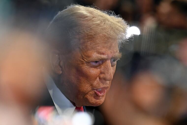 Former President Donald Trump talks with the media in the spin room at the Convention Center in Philadelphia following his debate with Vice President Kamala Harris on Tuesday, Sept. 10, 2024.
