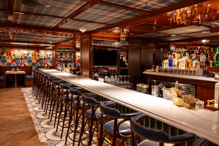One of the dining areas at Triple Crown features a bar.
