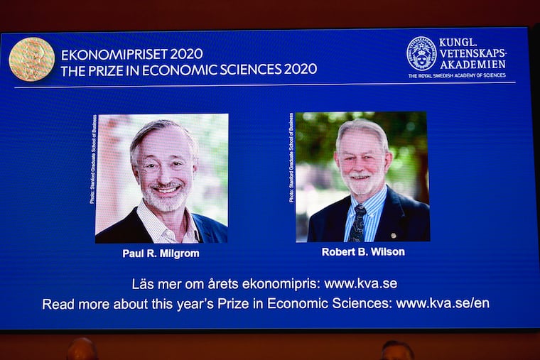 Winners of the Sveriges Riksbank Prize in Economic Sciences in Memory of Alfred Nobel for 2020 at a press conference in Stockholm, Monday Oct. 12, 2020. Americans Paul R. Milgrom, left, and Robert B. Wilson have won the Nobel Prize in economics for "improvements to auction theory and inventions of new auction formats."