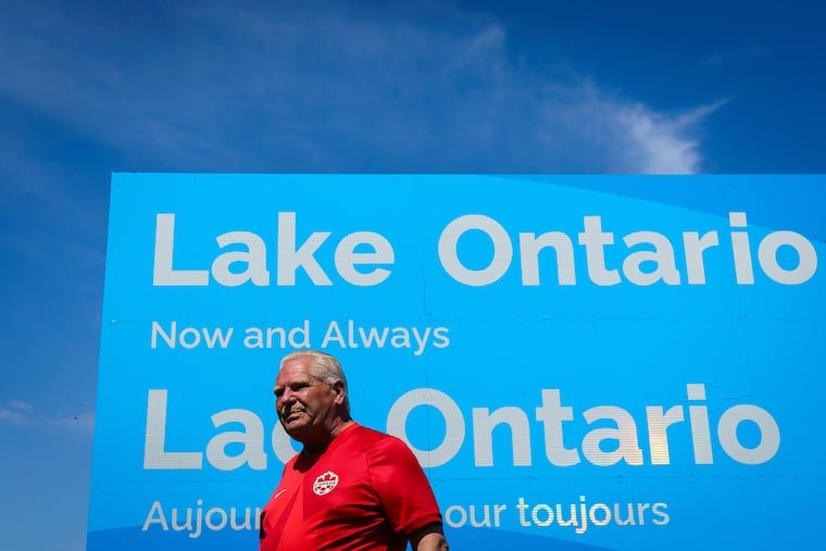 Ontario Premier Doug Ford unveils a sign for Lake Ontario at Fifty Point Conservation Area in Grimsby, Ontario, Canada, on Saturday, Aug. 29, 2026.