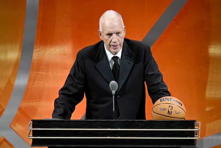 Doug Collins speaks during his enshrinement in the Naismith Memorial Basketball Hall of Fame on Sunday.
