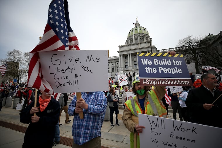 Protesters gather outside the Capitol Complex. They are calling for Gov. Tom Wolf to reopen up the state's economy during the coronavirus outbreak.
