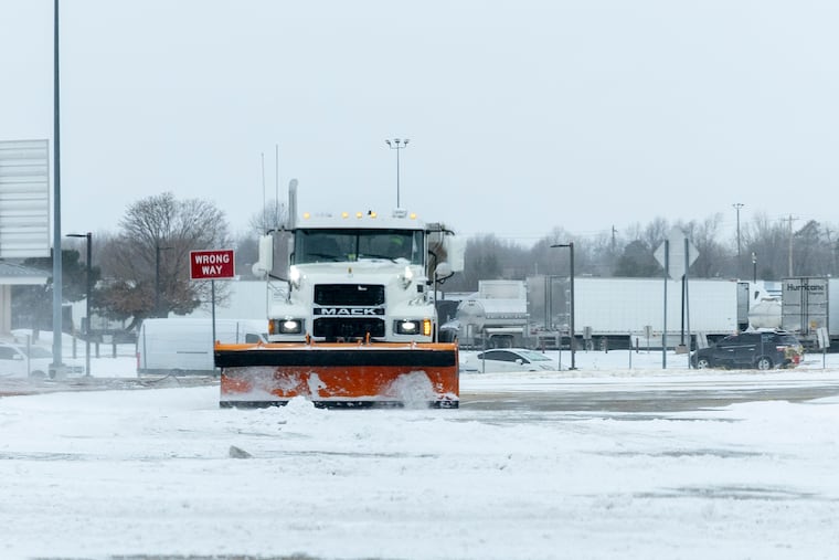 Oklahoma City street crews clear roadways of snow in Oklahoma City on Saturday, Jan. 24, 2026.