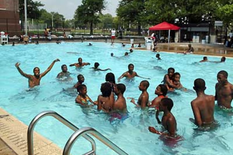 Children crowd the pool on a hot afternoon at Cecil B. Moore Recreation Center, one of many rec centers in the city in danger of closing because of decreased funding. (Sharon Gekoski-Kimmel / Inquirer)