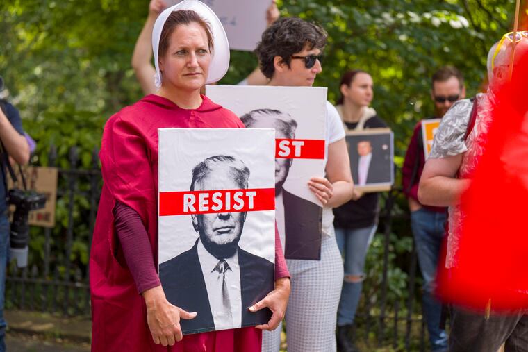 People take part in a Stop Trump Scotland protest outside the US Consulate in Edinburgh, as US President Donald Trump begins his five-day private trip to the country at his Turnberry golf course in South Ayrshire on Saturday.