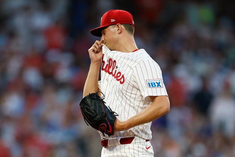Phillies pitcher Mick Abel wipes his face after New York Mets Juan Soto hit a third inning solo home run on Saturday, June 21, 2025 in Philadelphia.