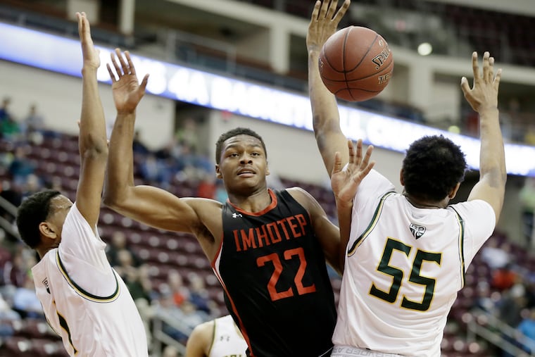 IMHOTEP # 22 Elijah Taylor loses control of the ball after being fouled in the first half of the Bonner-Prendergast vs. IMHOTEP H.S. PIAA Class 4A boys basketball championship at the Giant Center in Hershey, Pa. on March 21, 2019.