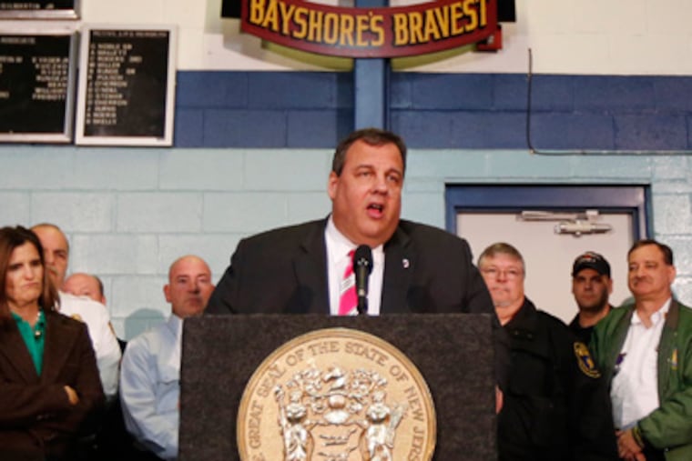 New Jersey Gov. Chris Christie, center, talks during a news conference at at fire house, Monday, Nov. 26, 2012, in Middletown, N.J. Christie announced he will seek re-election to a second term. Christie says he want New Jerseyans to know that he's "in this for the long haul" as he leads the state's recovery from Superstorm Sandy. (AP Photo/Julio Cortez)