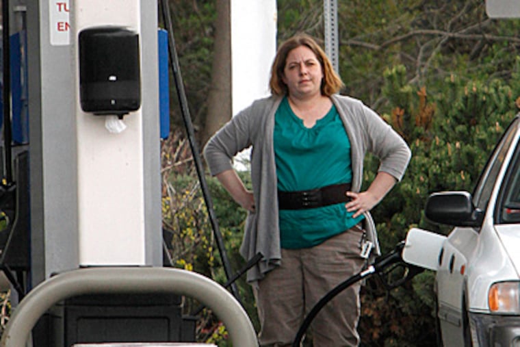 Filling up in Montpelier, Vt., on Friday. The national average for gas has been declining after a grueling winter-into-spring. The national average closed the workweek at $3.88. TOBY TALBOT / AP