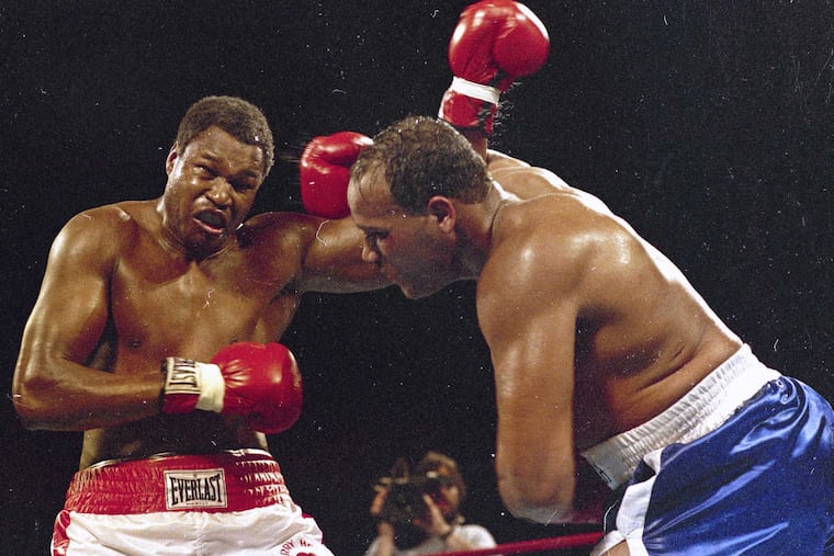 Heavyweight boxers David Bey (right) and Larry Holmes spar during a bout in Las Vegas on March 15, 1985.