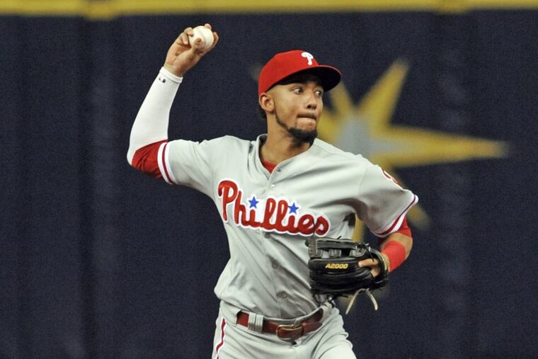 Phillies shortstop J.P. Crawford throws to first base after fielding a ground ball against the Tampa Bay Rays on Saturday.