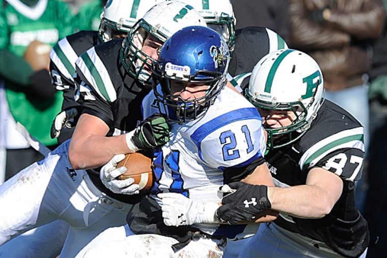 Quakertown running back Rob Burns on Thanksgiving in 2013. (Bradley C Bower/Staff)