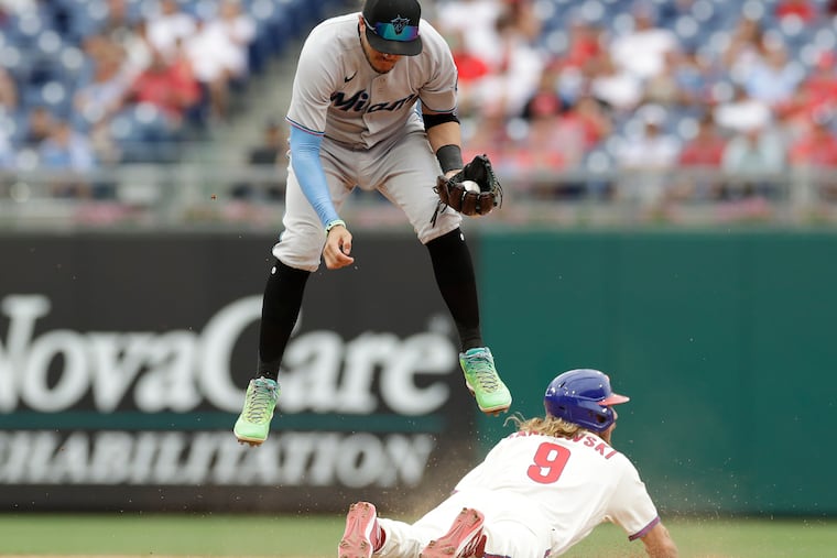 A diving Travis Jankowski steals second base during the Phillies' 7-4 win over the Miami Marlins Sunday at Citizens Bank Park.