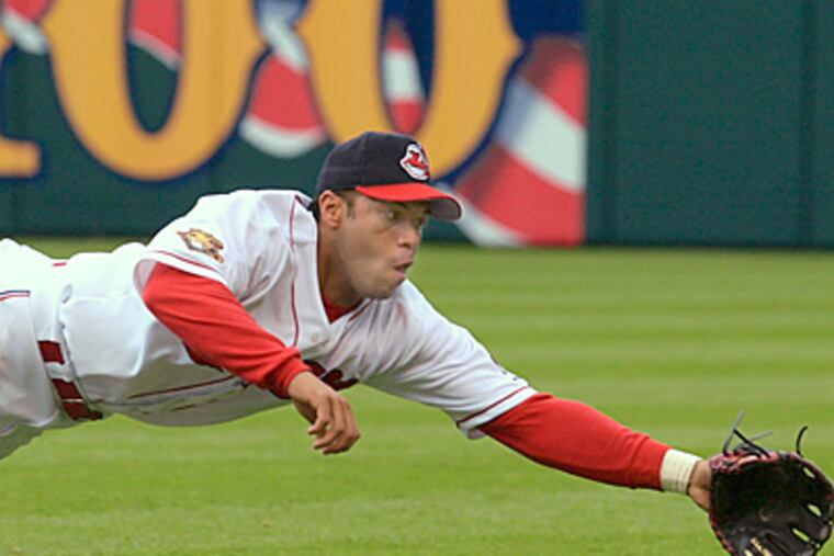 Cleveland Indians second baseman Roberto Alomar dives but can't get to a ball during the 2001 season. (AP Photo/Mark Duncan)