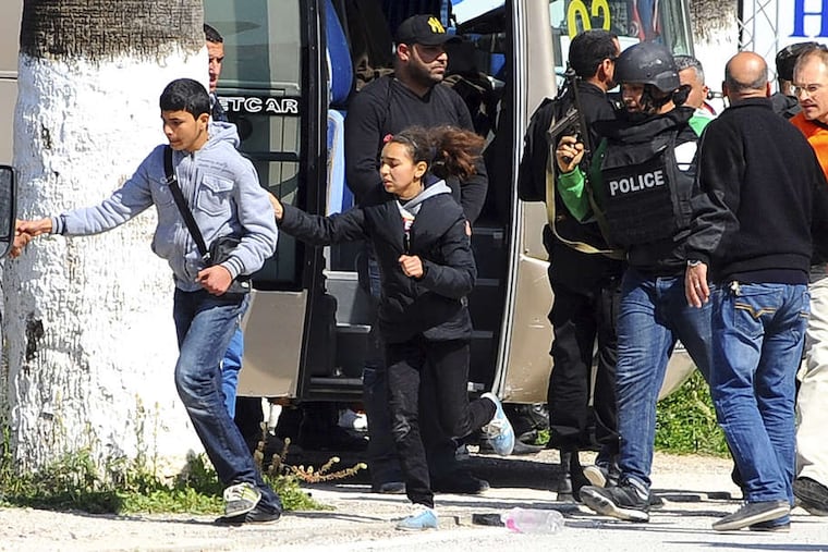 Tunis' National Bardo Museum, where an attack by at least two gunmen killed 17 tourists and two Tunisians, is evacuated.