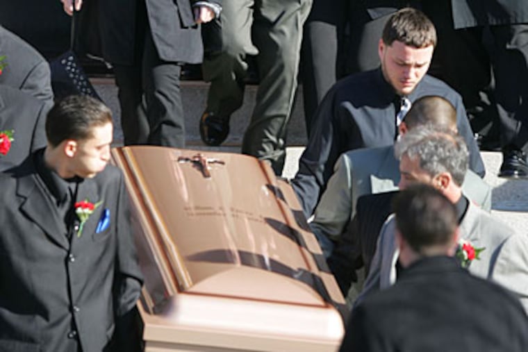 The body of William Panas, Jr., the 21-year-old who was shot by an off-duty police officer in Port Richmond last weekend is carried from Nativity BVM in Port Richmond. ( David Swanson / Staff Photographer )