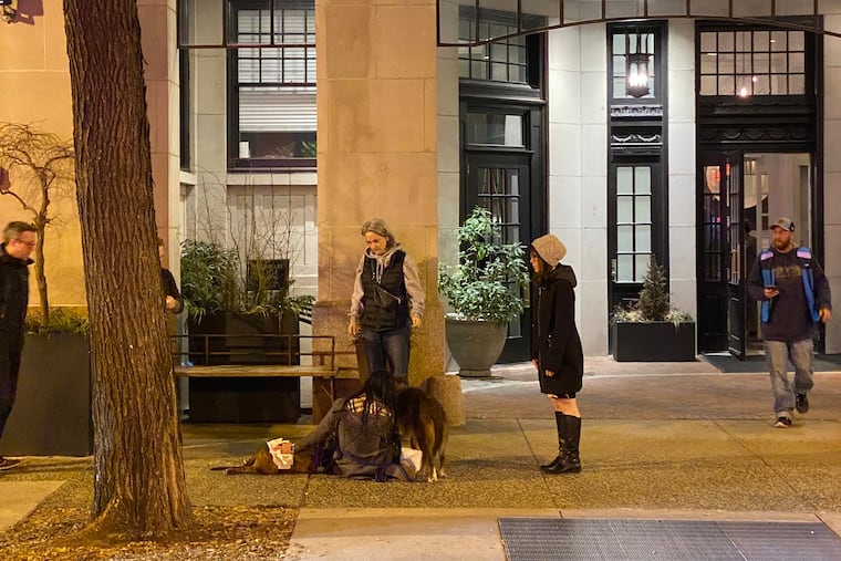 The scene outside the Touraine Apartments on Monday after an off-duty FBI agent (center) fatally shot a dog on the 1500 block of Spruce Street in Center City. Sources identified the shooter as Jacqueline Maguire, who has served as the special agent in charge of the FBI’s Philadelphia Field Office since 2021.