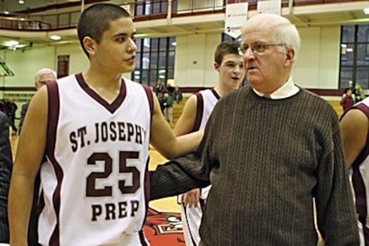 St. Joseph's Prep guard Mike Fee congratulates coach Speedy Morris
after the game. (David M Warren/Staff Photographer)