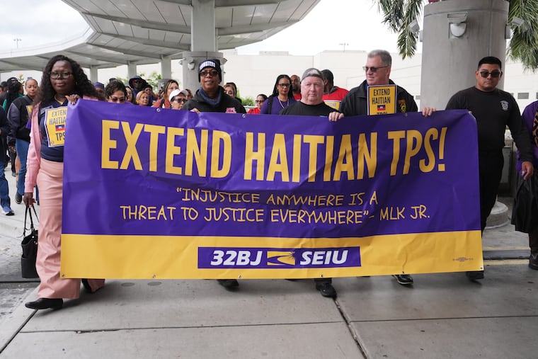 Demonstrators march through Fort Lauderdale, Fla., in January during a rally in support of the extension of Temporary Protected Status (TPS) for Haitian immigrants.
