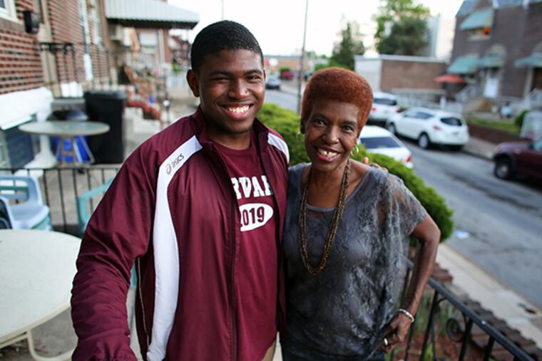 Brandon Dixon and his mother, Virginia Dennis, pose for a photograph, Friday, May 8, 2015, outside their home in the Juniata Park section of Philadelphia. ( Joseph Kaczmarek / For The Inquirer )
