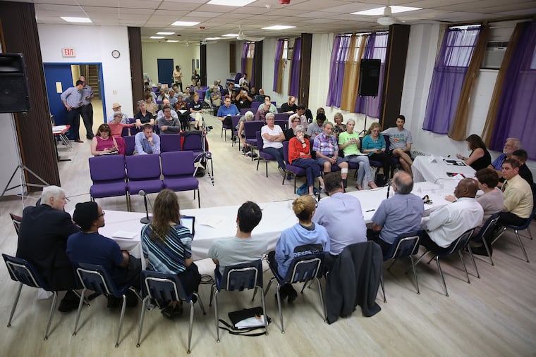 Pennsylvania Redistricting Reform Commission members sit with attendees during a public input meeting at Tindley Temple United Methodist Church in South Philadelphia on Tuesday, May 28, 2019. The commission, established by Gov. Tom Wolf, is seeking input from residents across the state on how future legislative districts should be drawn.