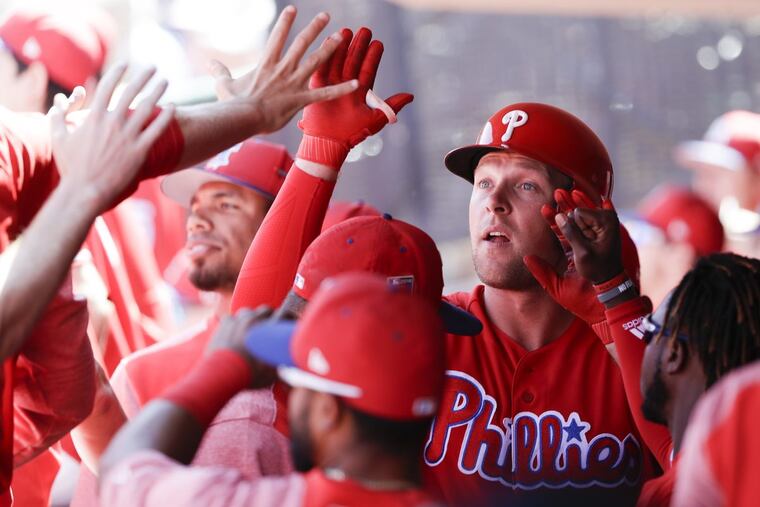 Rhys Hoskins celebrates his second-inning solo home run with his teammates.