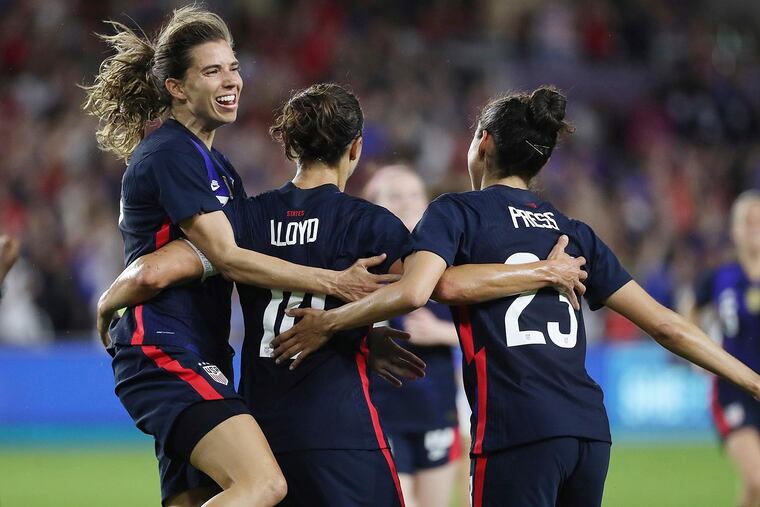 Carli Lloyd (center) and Christen Press (right) scored for the United States against England