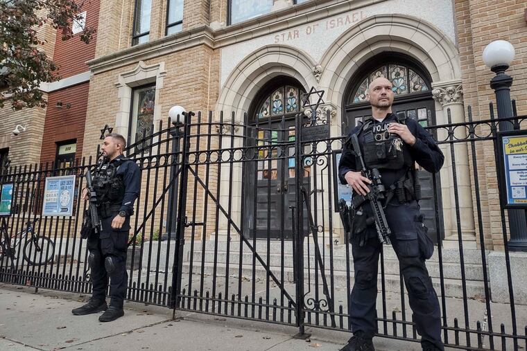 Hoboken Police officers stand watch outside the United Synagogue of Hoboken on Nov. 3, 2022, in Hoboken, N.J. The FBI said it has received credible information about a threat to synagogues in New Jersey.