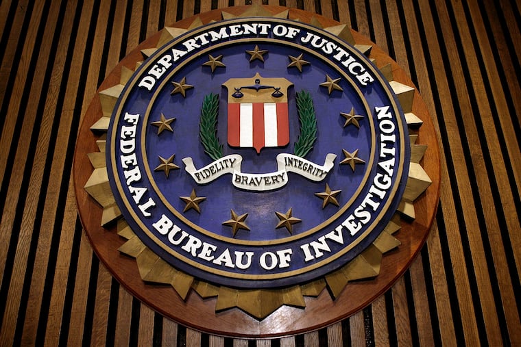 The seal of the FBI hangs at the bureau's Washington headquarters in this file photo.