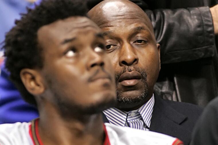 The departure of Moses Malone, right, left a gaping hole that the likes of Samuel Dalembert have been unable to fill. (AP File Photo)