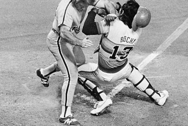 Pete Rose ran over Bruce Bochy, then the catcher for the Astros, in the 10th inning of Game 4 of the 1980 NLCS. (AP file photo)