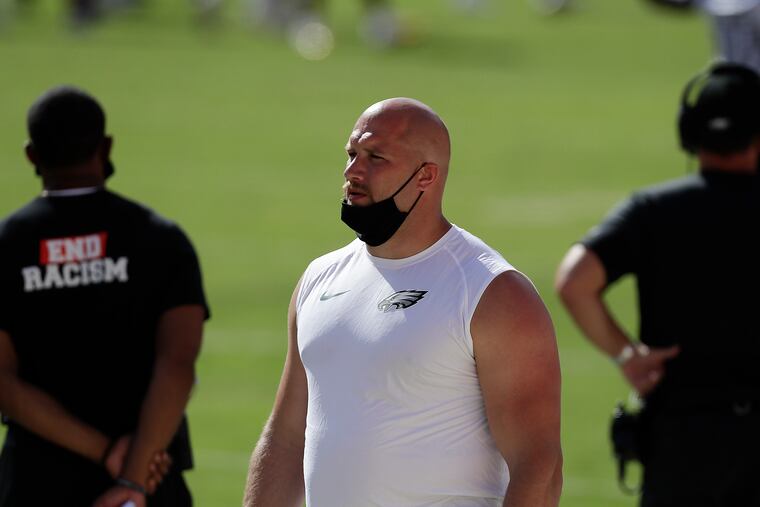 Injured Eagles offensive tackle Lane Johnson on the sidelines last Sunday.