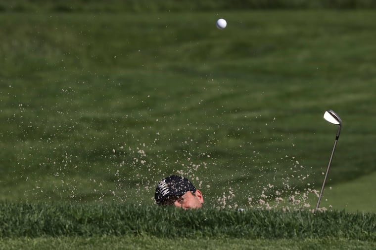 Francesco Molinari hits out of a bunker on the 11th hole during a practice round for the PGA Championship.