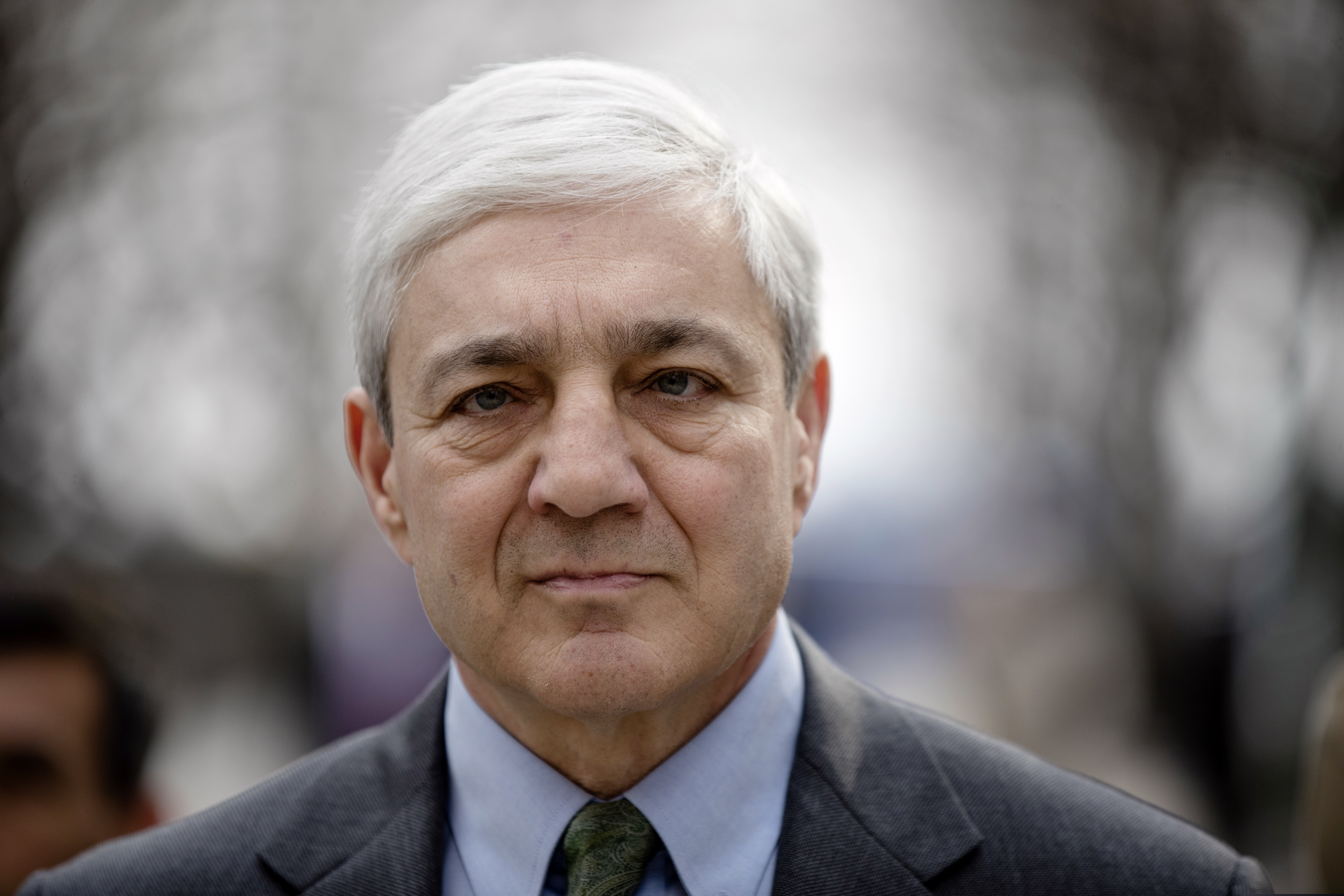 Former Penn State president Graham Spanier walks from the Dauphin County Courthouse in Harrisburg, Pa., in this file photo.