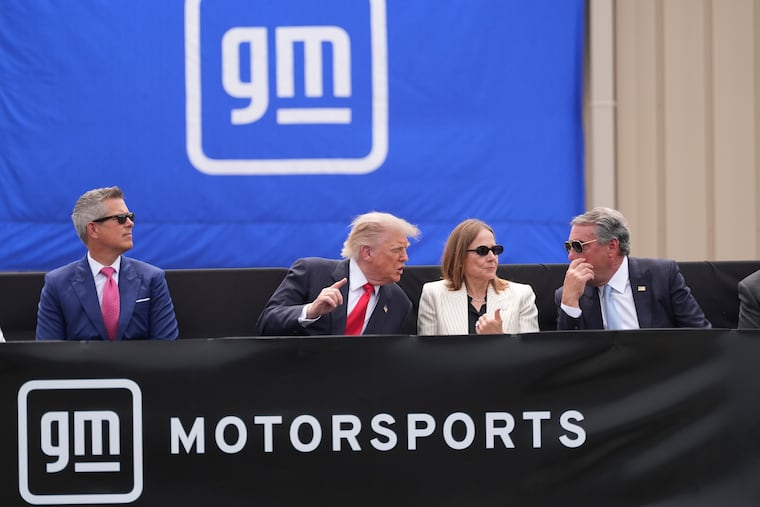 President Donald Trump (center left) speaks with Mary Barra, chairperson and CEO of General Motors, and General Motors President Mark Reuss as Transportation Secretary Sean Duffy (left)listens during a driving demonstration at General Motors proving ground, Monday, July 27, 2026, in Milford, Mich.