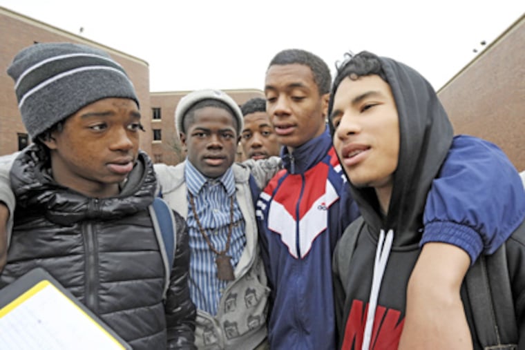 Jorge Alvarado (right), a 15-year-old freshman, and his friends discuss the possible shutdown. The state is refusing to bail out the district. (Clem Murray / Staff Photographer)