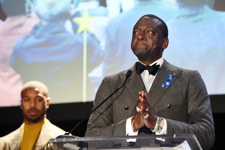 Honoree Yusef Salaam, right, becomes emotional as he addresses the audience at the ACLU SoCal's 25th Annual Luncheon at the JW Marriott at LA Live, Friday, June 7, 2019, in Los Angeles. Looking on at left is presenter Michael B. Jordan.