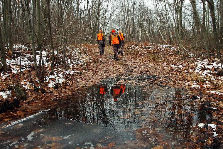In this 2013 file photo hunters take to the woods at Jessup Mountain in Jessup, Pa., during the first day of deer season. The Pennsylvania Game Commission wants to set the record straight after apparent misinformation recently made its rounds on social media.